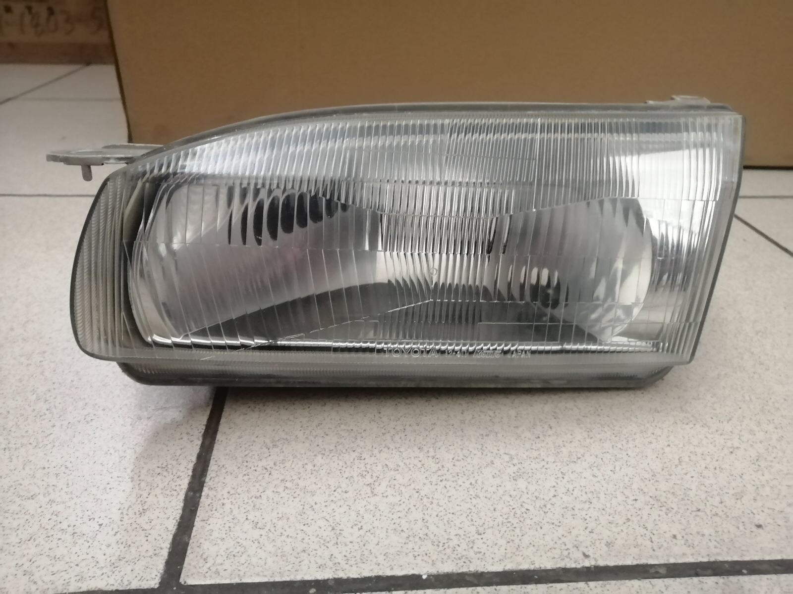 Фара TOY COROLLA 110 12-411 L  -98 [б/у] на TOYOTA COROLLA
